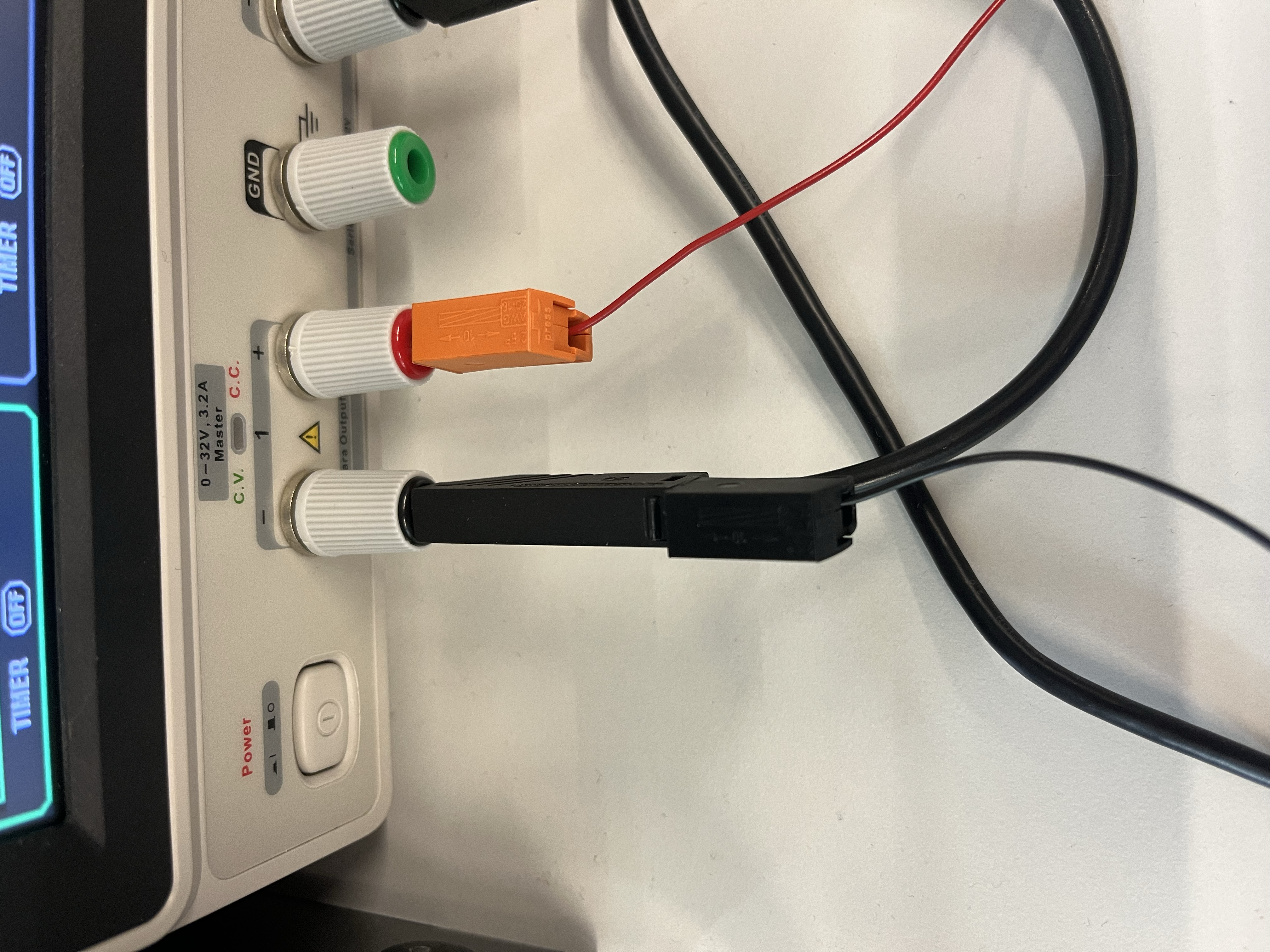 The supply-side of the banana-jack cable with the PCB power ground piggybacking