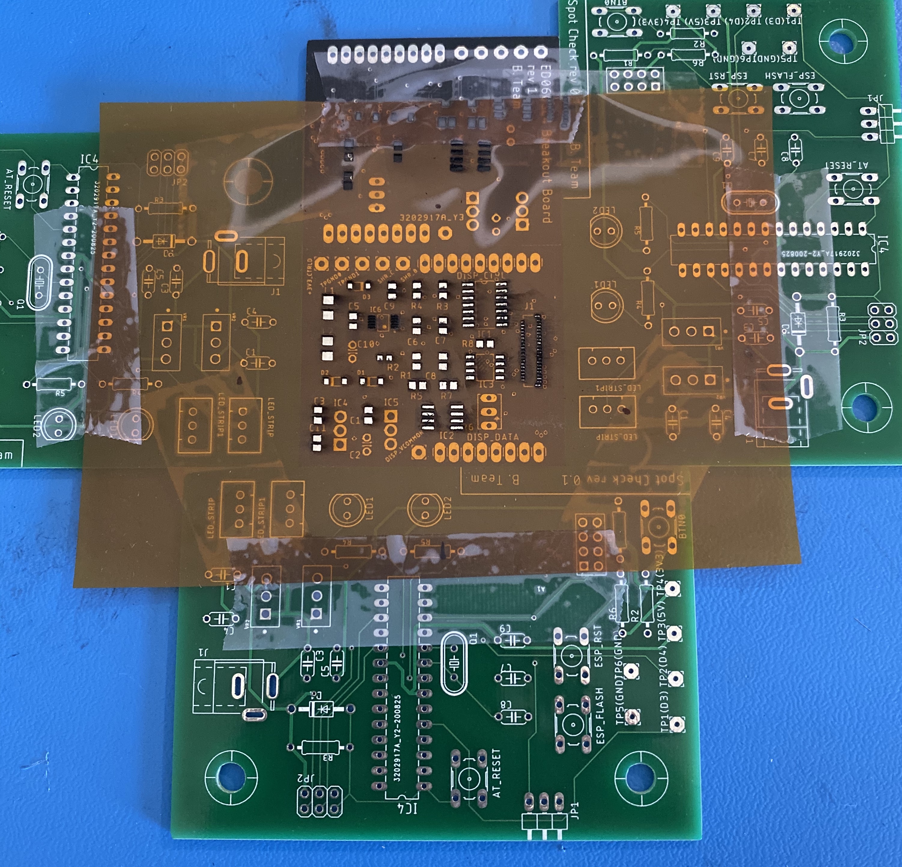 The board and stencil set up with a surrounding layer of other PCBs for a smooth application