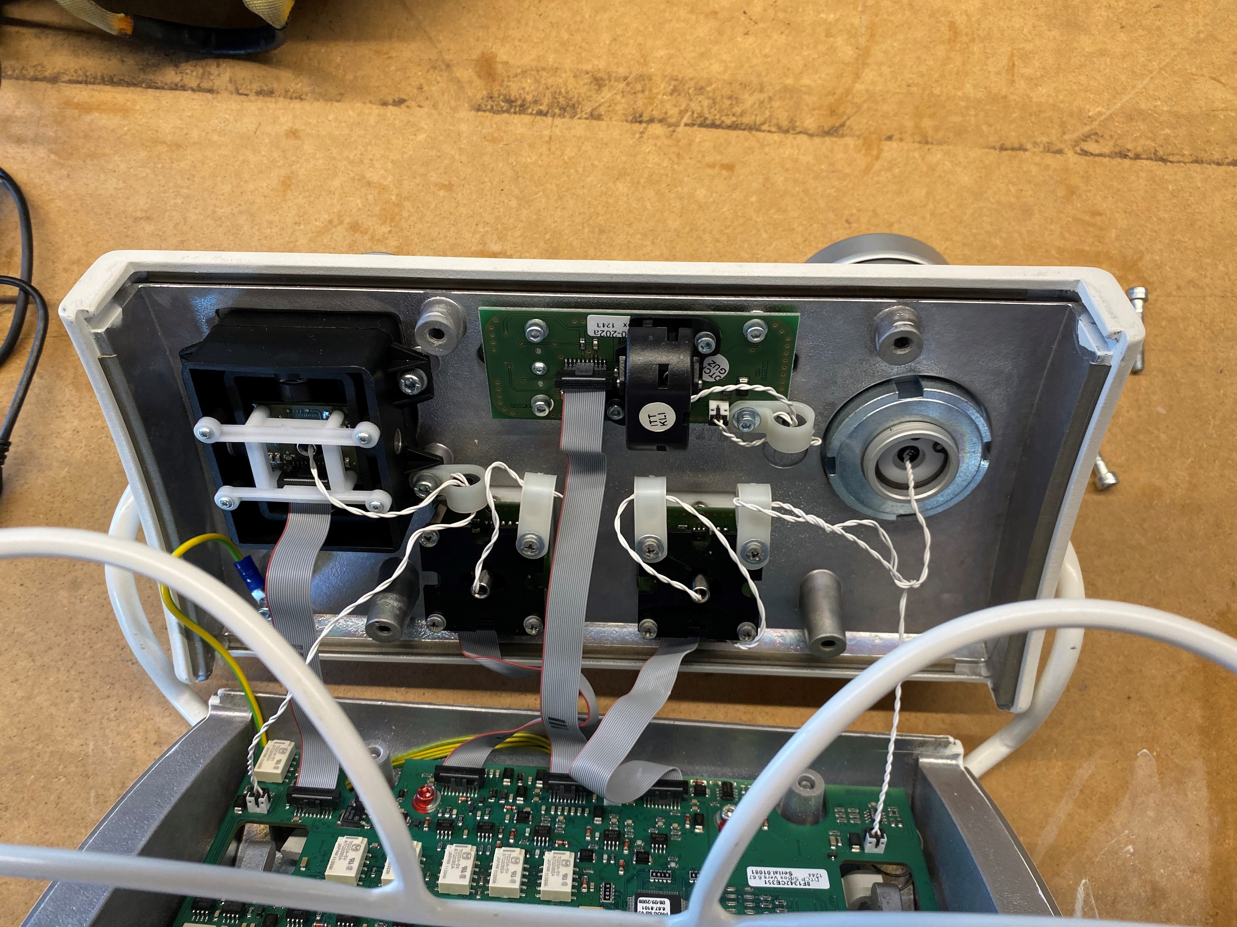 The front half of the joystick unit comprised of each joystick&rsquo;s daughterboard and its ribbon cable attachment to the main board