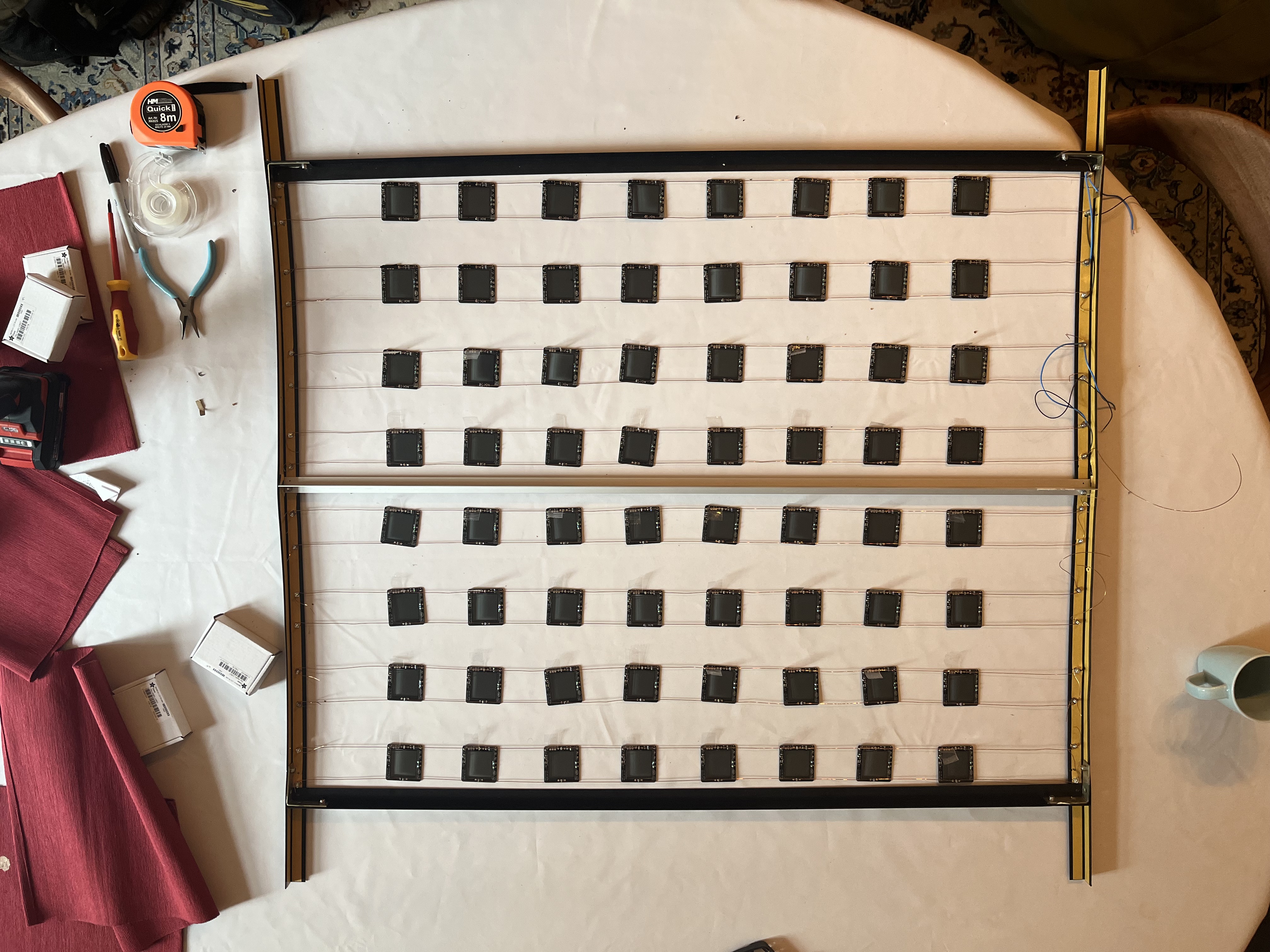 Assembled grid flat on the table before attaching drivers