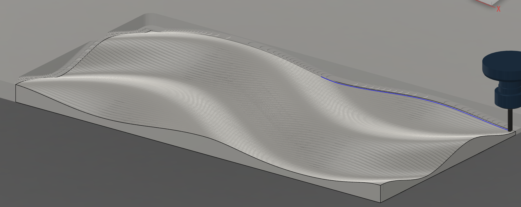 The CAM stage, with simulated toolpaths showing parallel toolpath  grooves